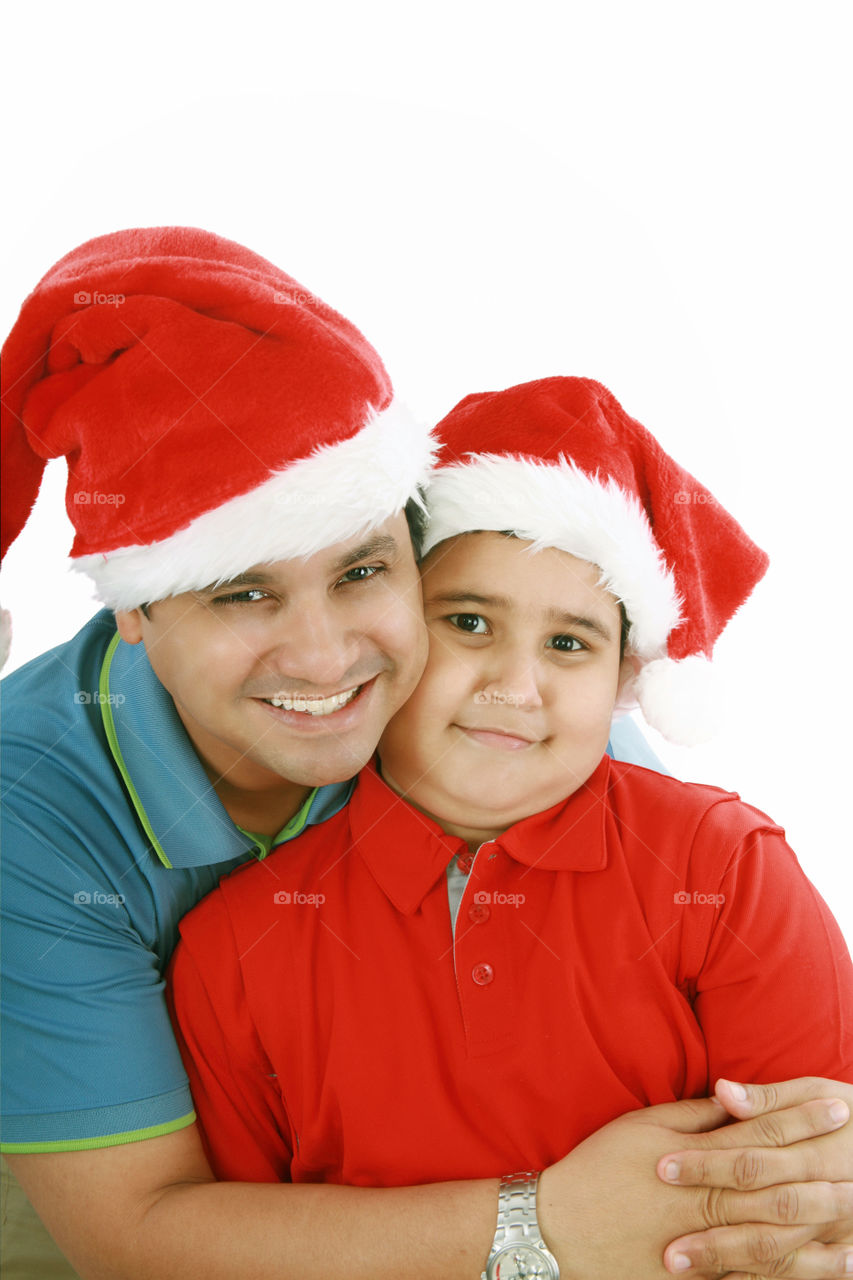father and son with Christmas hats