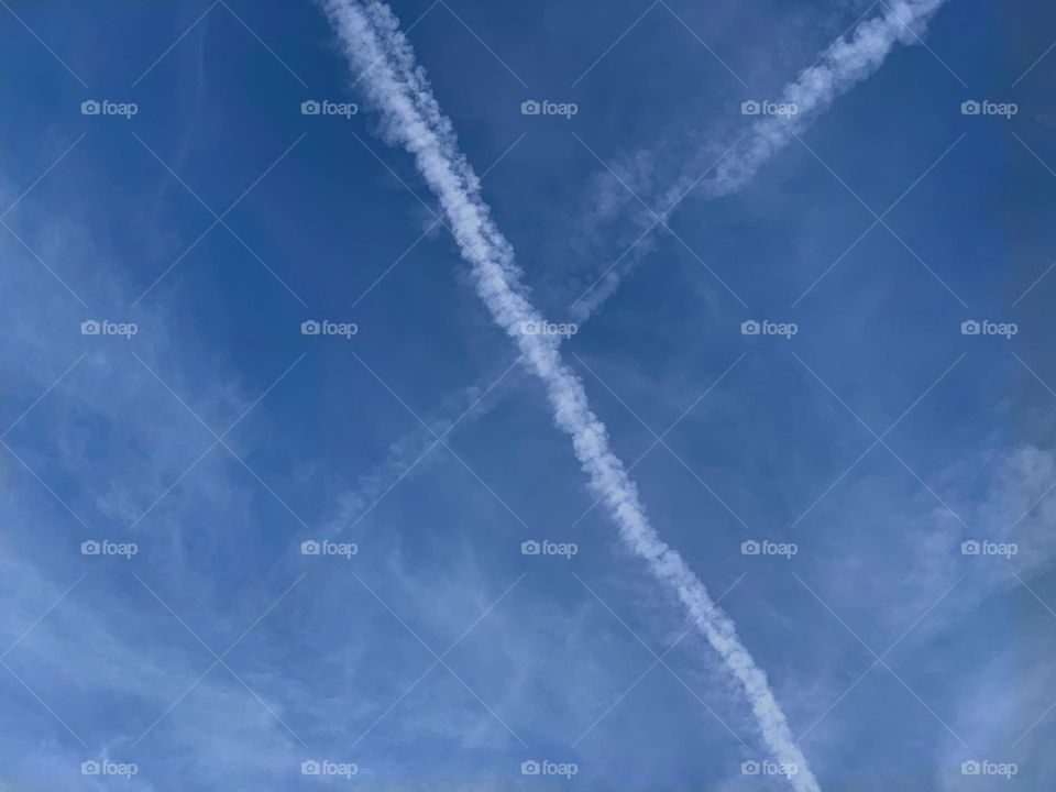 Crisscrossed Contrails.