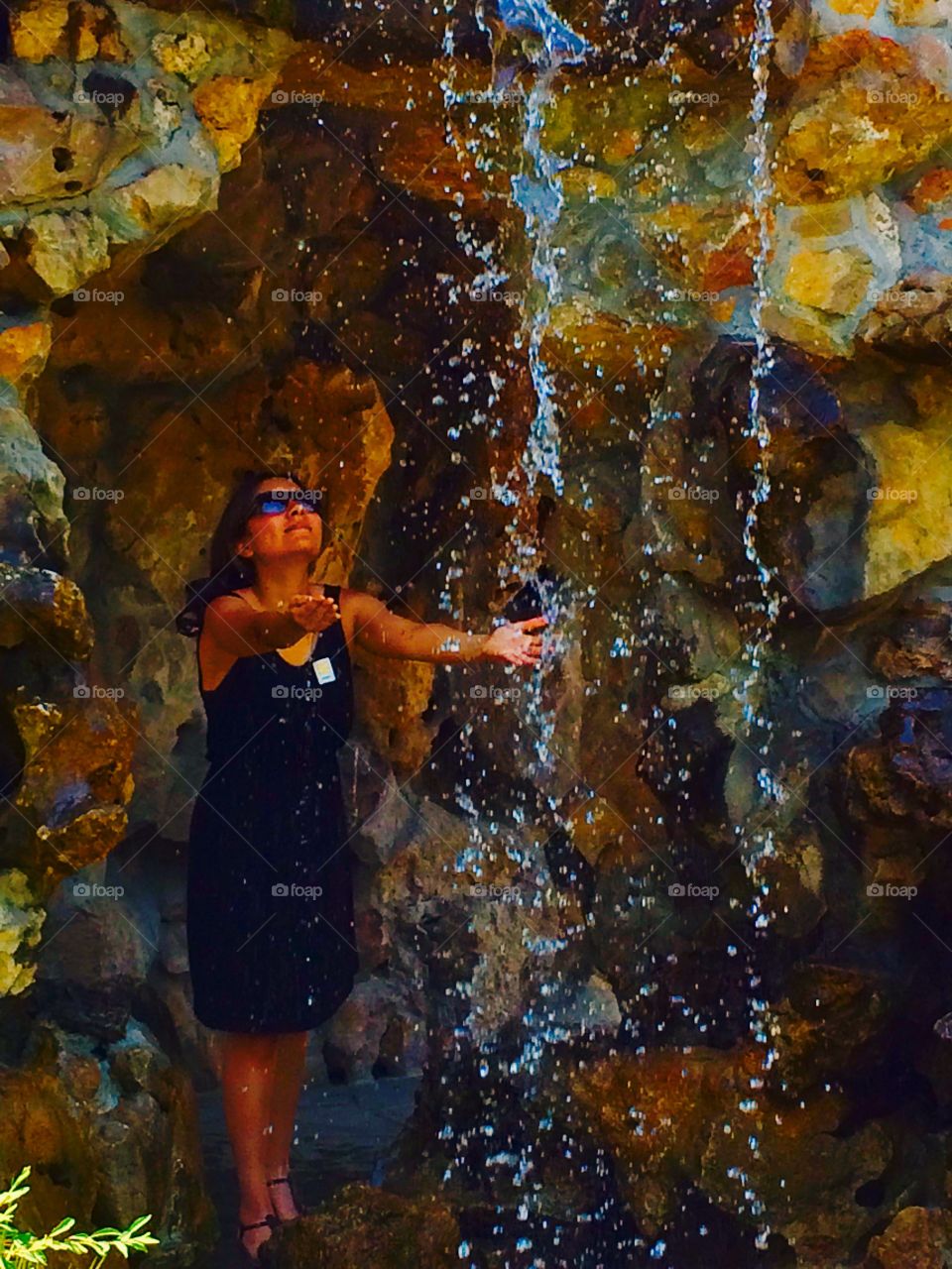 Woman enjoying waterfall