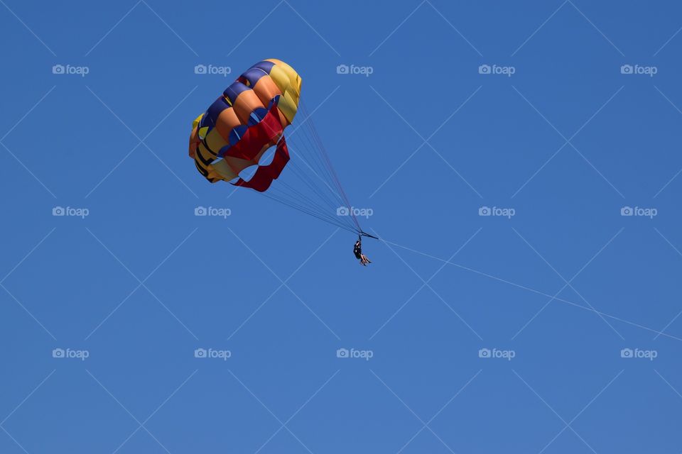 Low angle view of parasailing