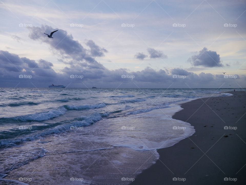 The waves of the ocean abd cloudy sky in the morning 