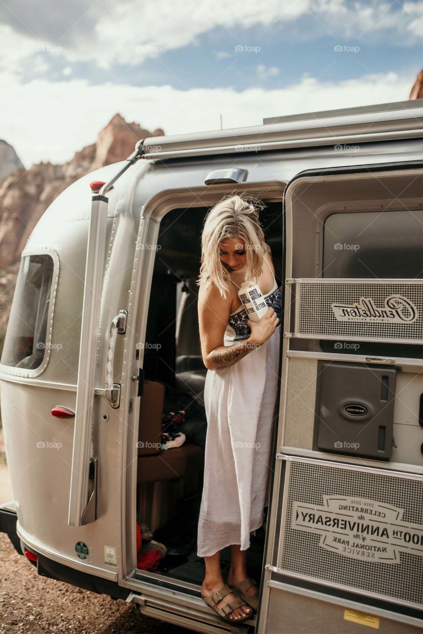 woman standing on vehicle door