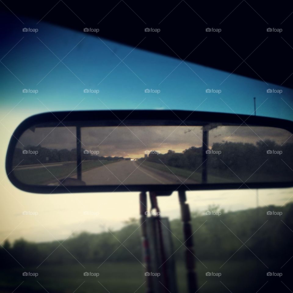 Louisiana thunderstorm in rear view mirror 