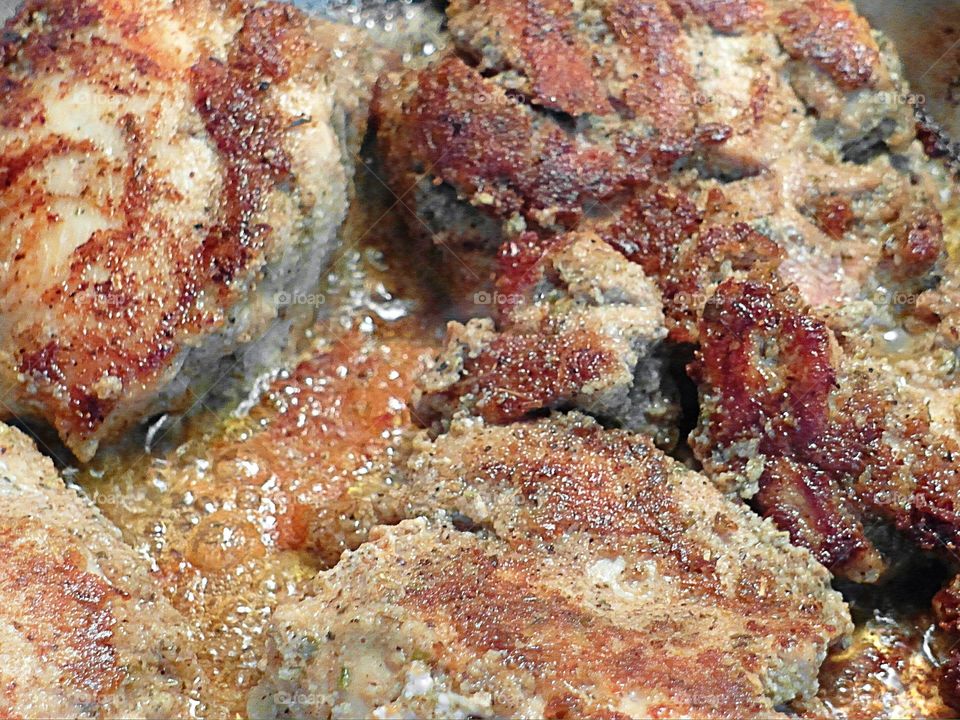 Close up of chicken cooking 