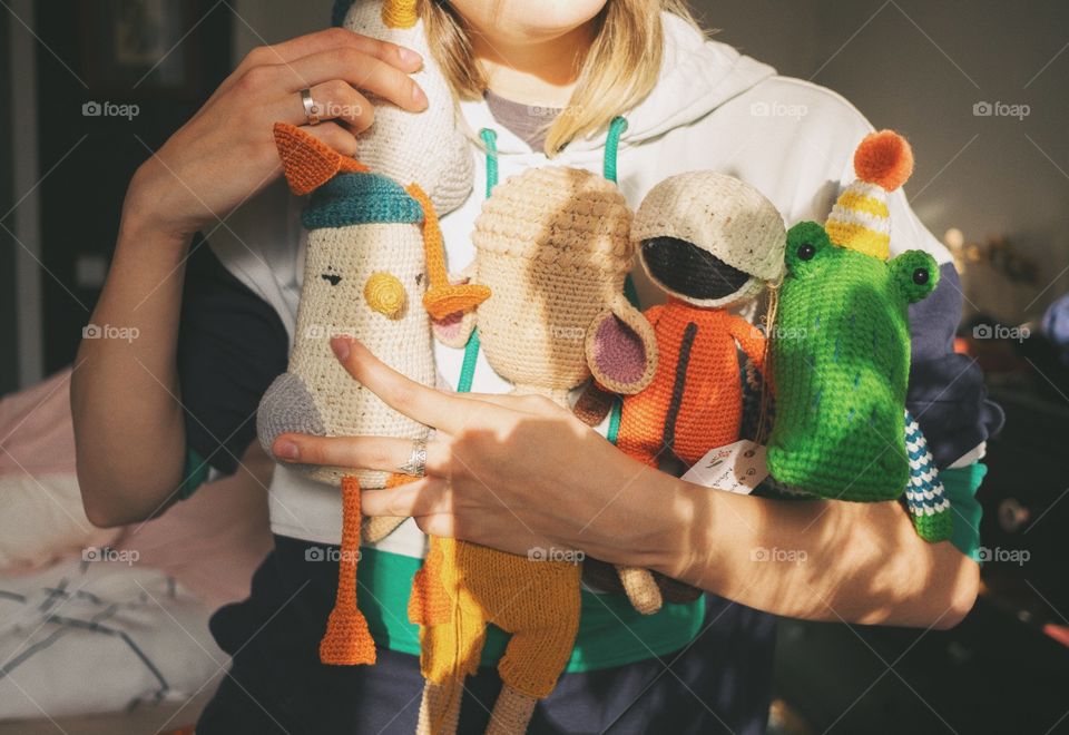 Woman holding dyi crochet amigurumi toys