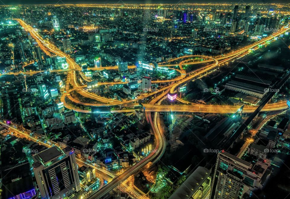 Beautiful night scene of vehicle light on express way in Bangkok city Thailand