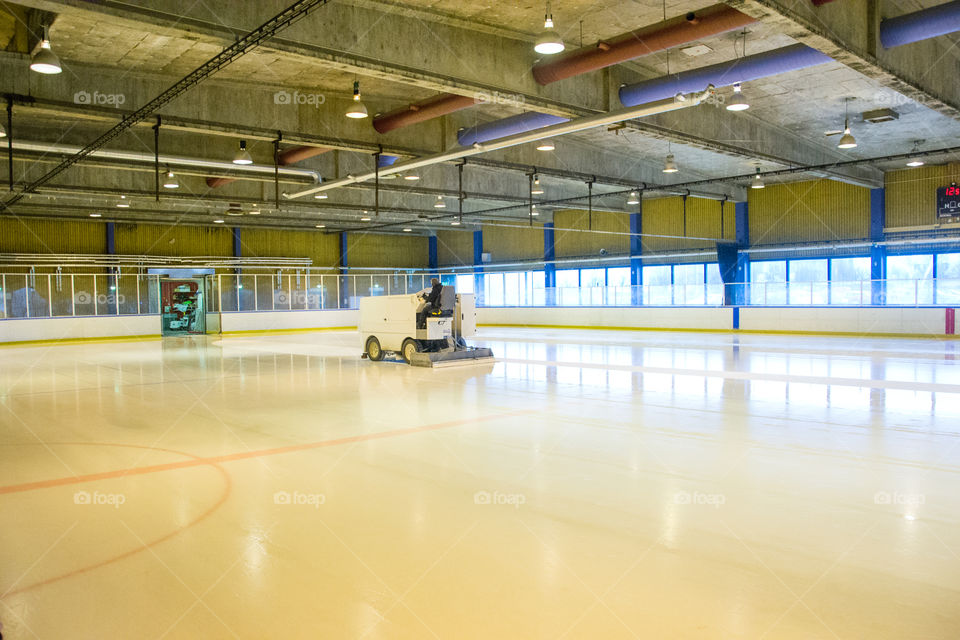 Ice resurfacing machine in work.
