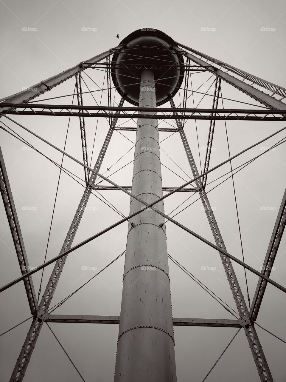Vintage water tower under a gray Kansas sky
