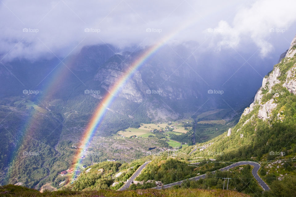 Double rainbow over a valley Lysebotn. Norway