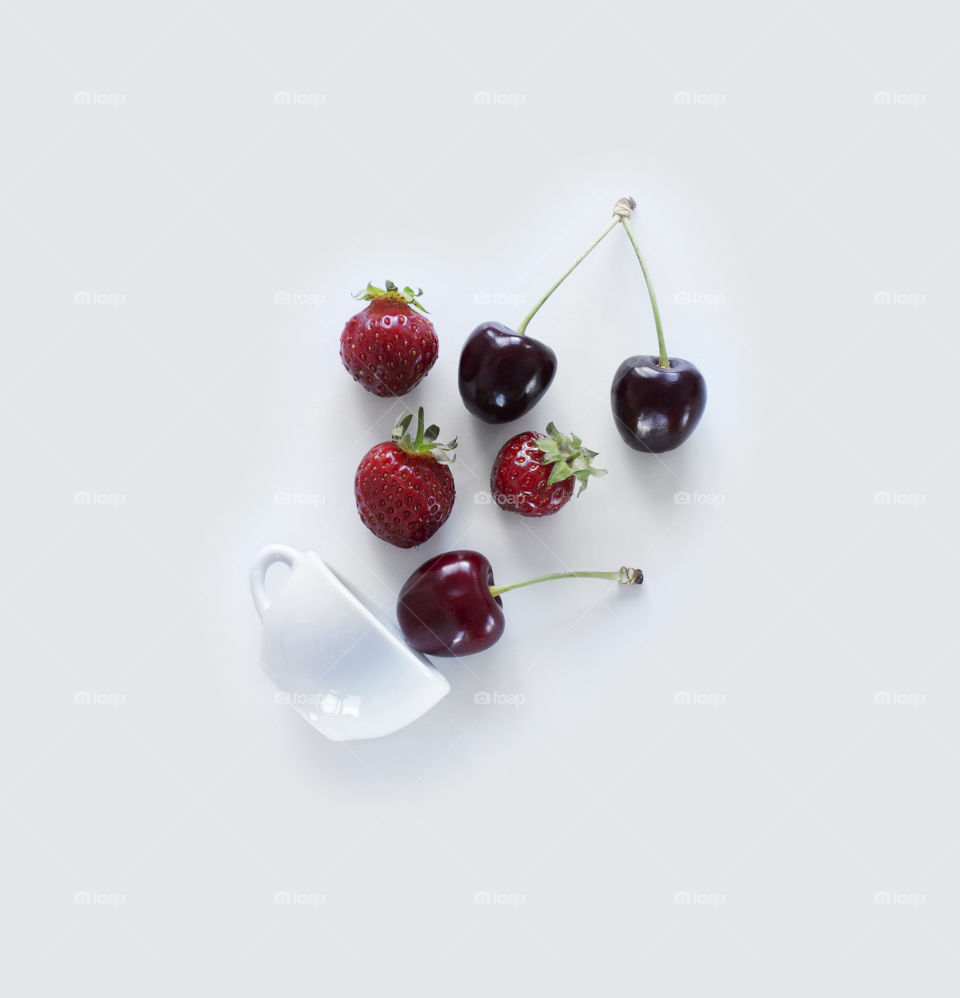 Cherry and strawberry on a white background 
