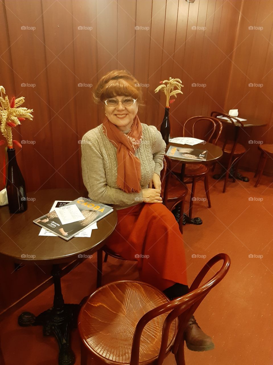 young woman in a cafe at a table