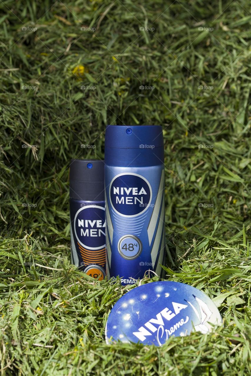 Nivea deodorants on green grass background