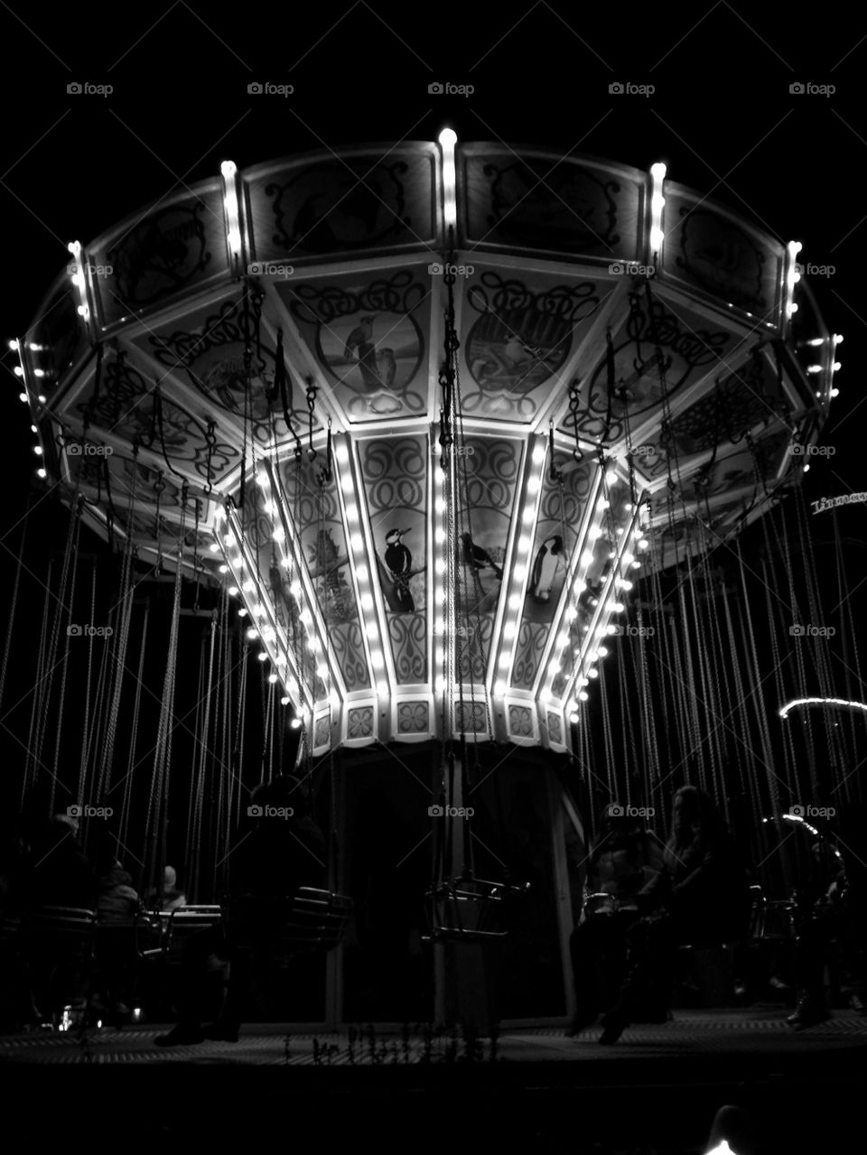 Carousel at Linnanmäki amusement park light carnival