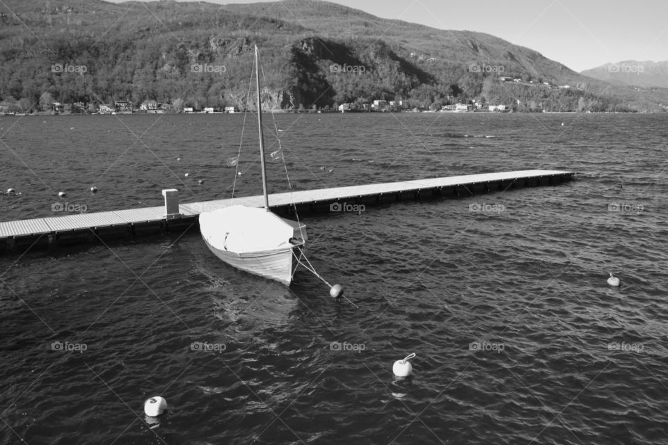 Boat, Ceresio lake and a cold Winter's day - Porto Ceresio, Varese, Italy.