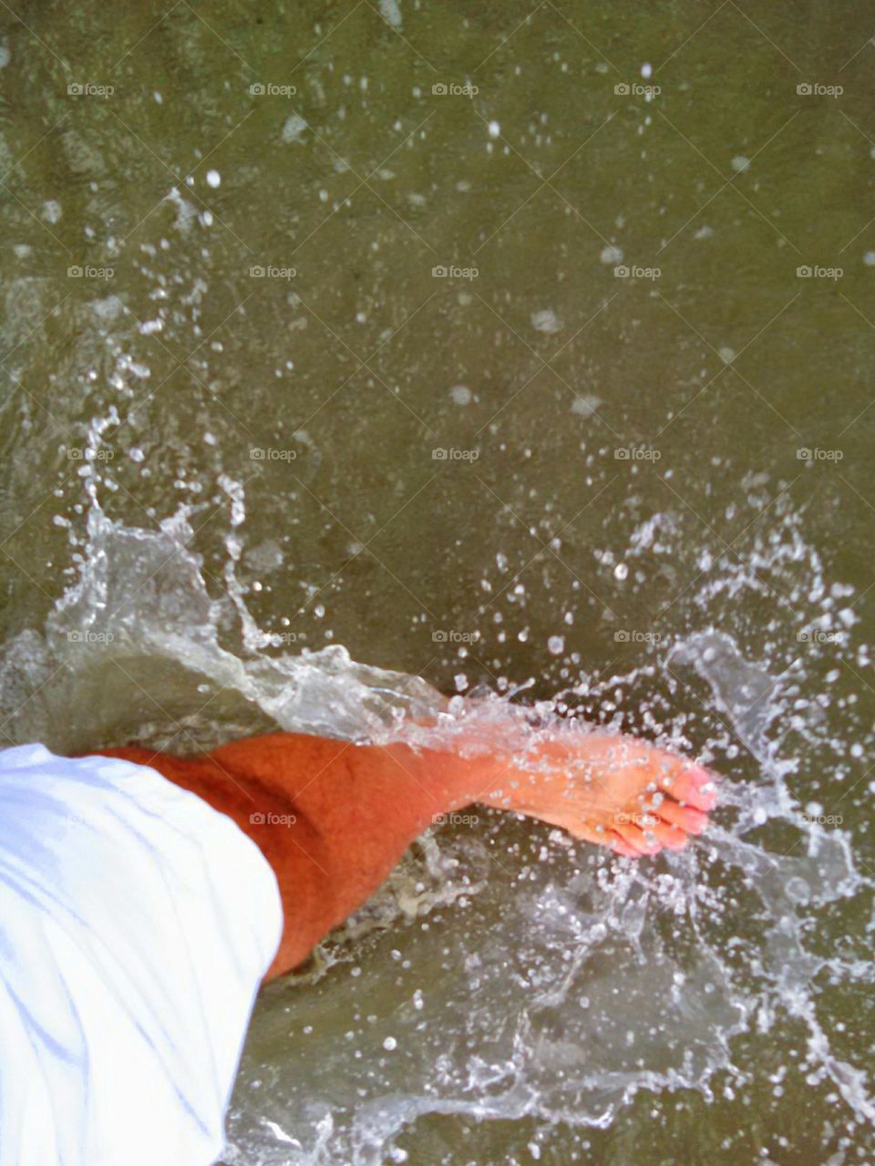 Splash. A casual stroll through the surf  on the beaches of Hilton Head Island, South Carolina.