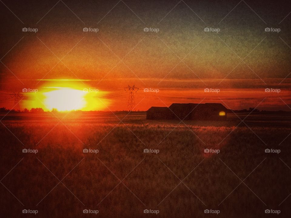 Sunset over abandoned farm 