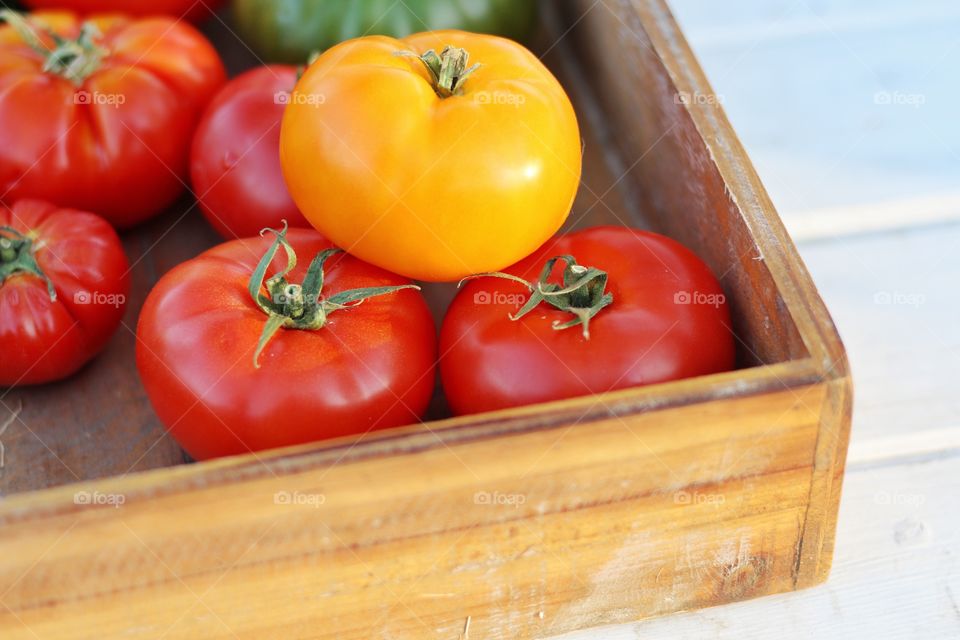 Tomatoes in wooden box