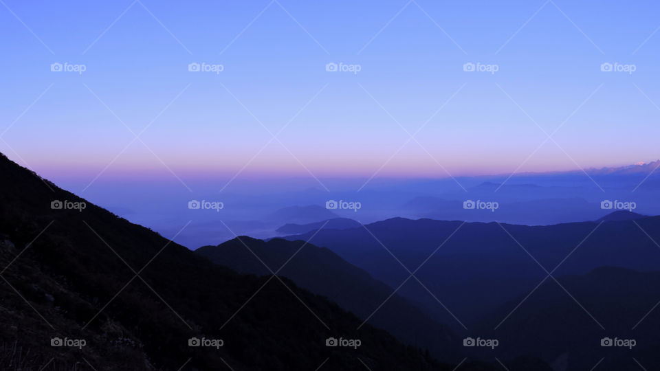 Silhouette of mountains during sunset