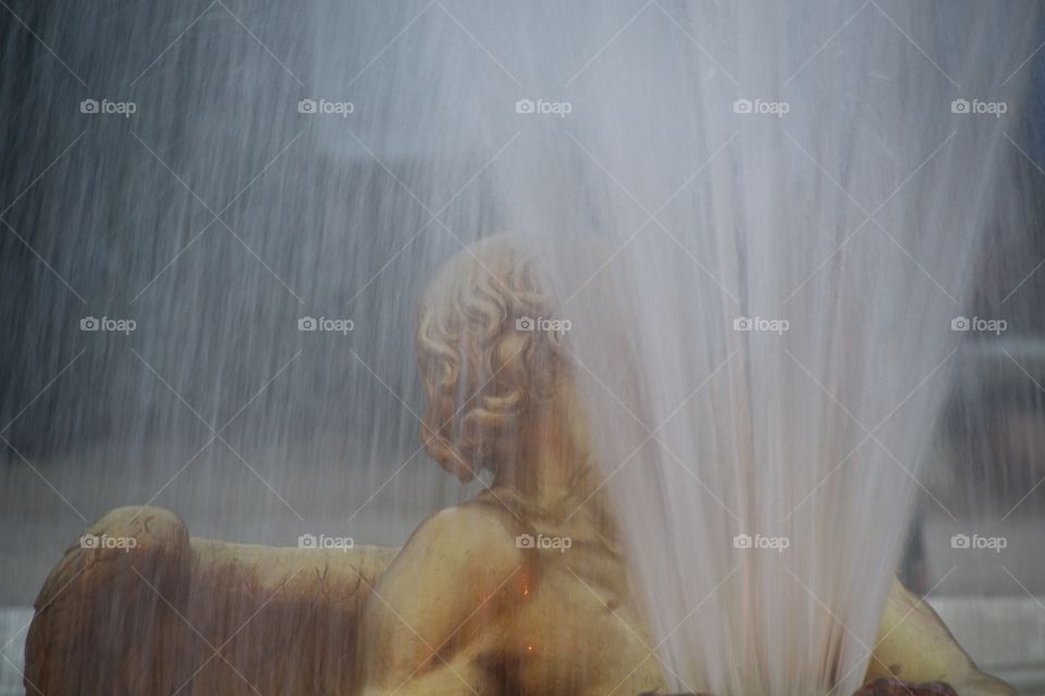 statue of a person in a garden