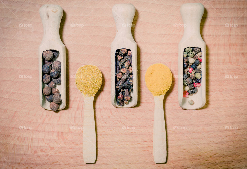 Raw pasta with ingredients and wooden accessories