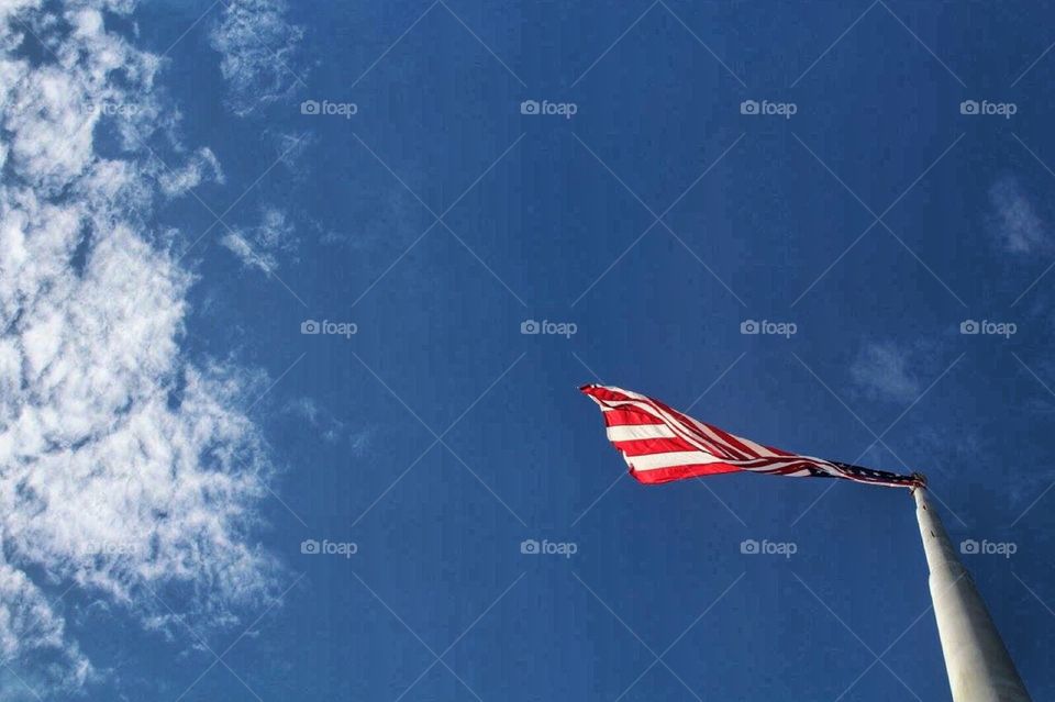 God Bless America. An up shot of an American flag 