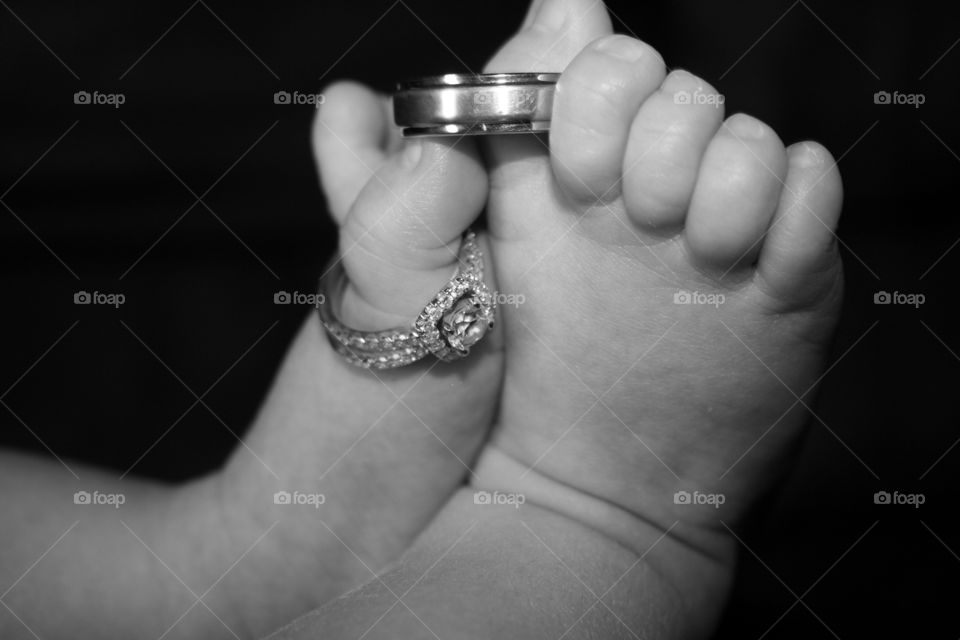 Mommy and Daddy's Rings . The parents wedding rings fit loosely over their newborn's toes. 