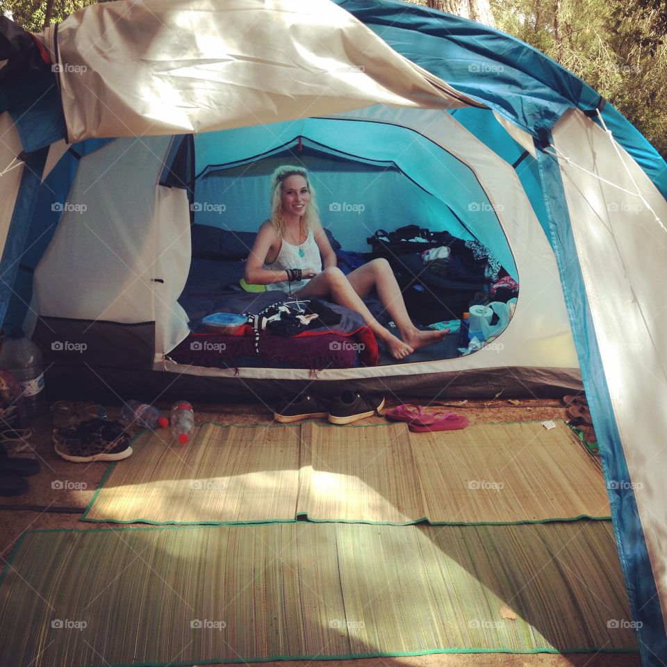 Woman sitting in tent