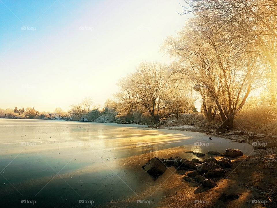 View of frozen lake at dawn