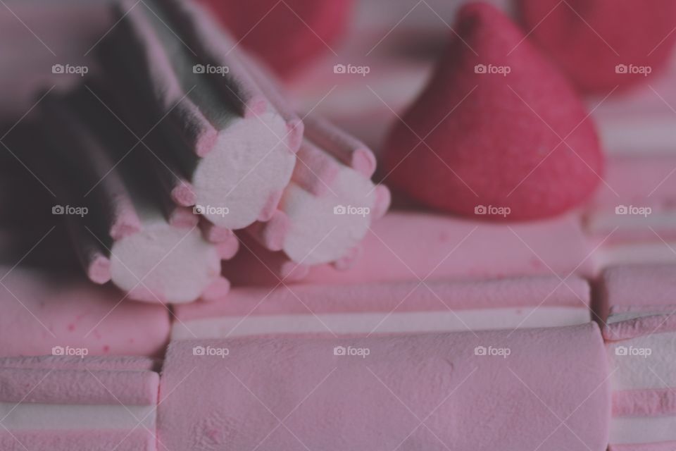 Pink white red drop marshmallow sweet candy snack pastel colour food closeup background strip sugar delicious dessert 