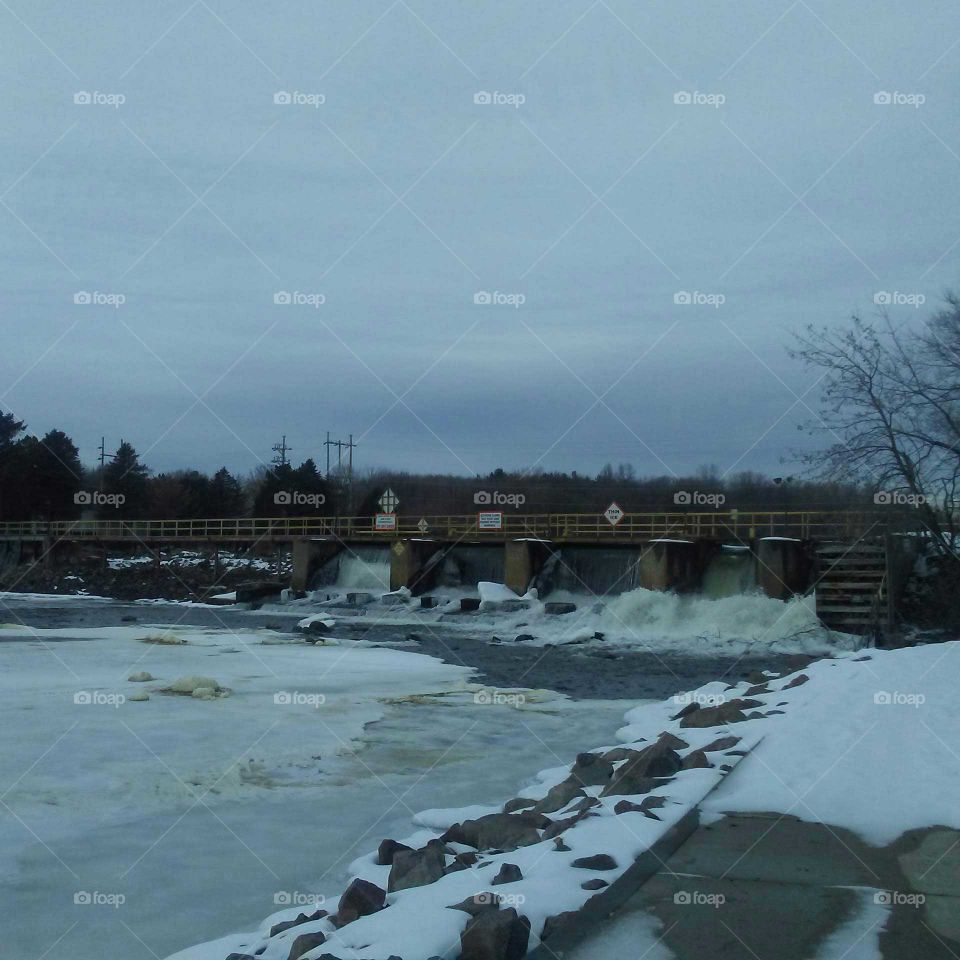 Frozen Wolf River by the dam at Sturgeon Park in Shawano, Wisconsin last winter.