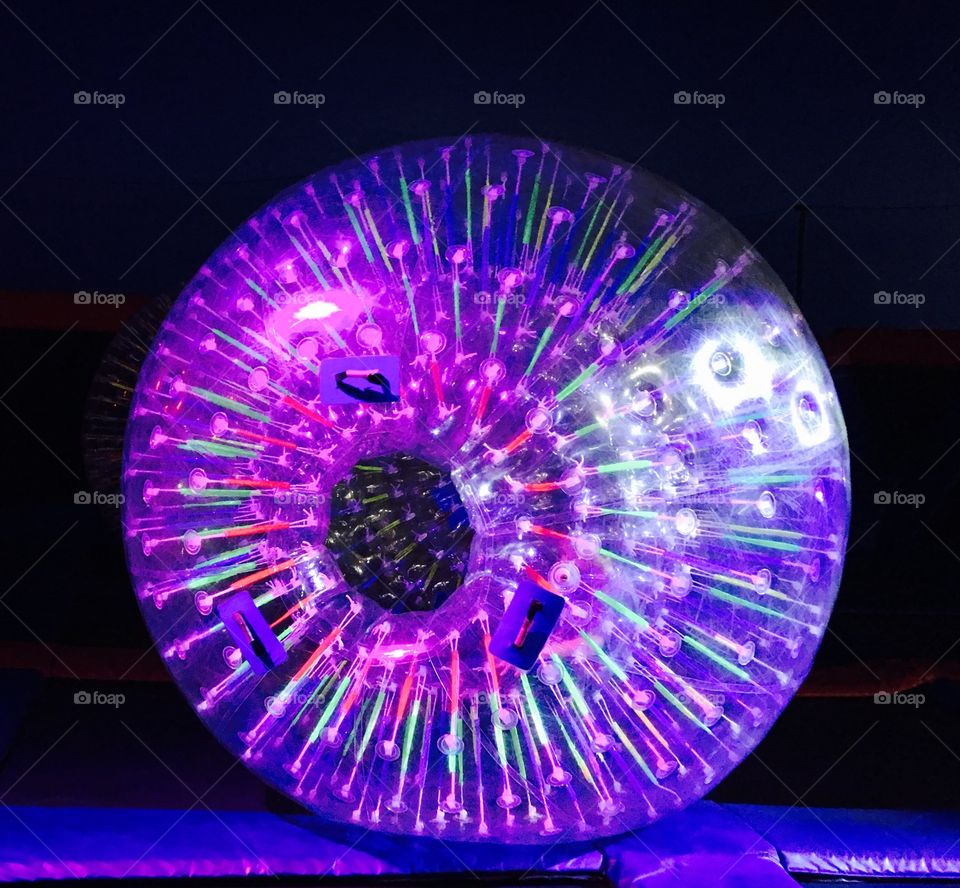 Bouncing ball reflecting purple led lights