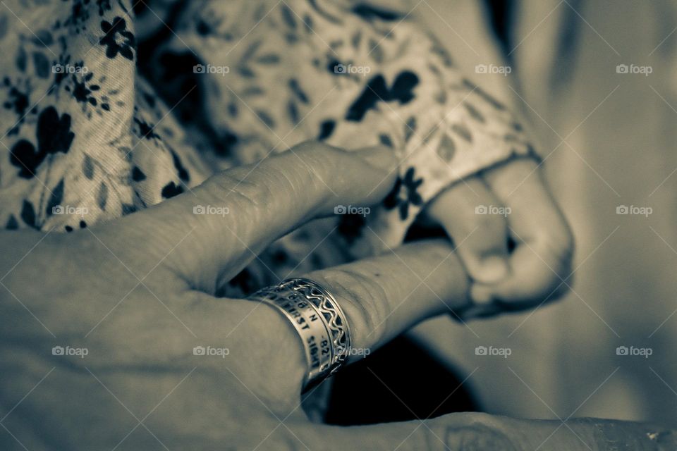 Woman wearing favorite rings, spinner rings on ring finger, baby holding mother’s ring finger, stacked rings on ring finger, my favorite jewelry contest, wearing my favorite jewelry, longitude and latitude ring, place we met, couples rings 