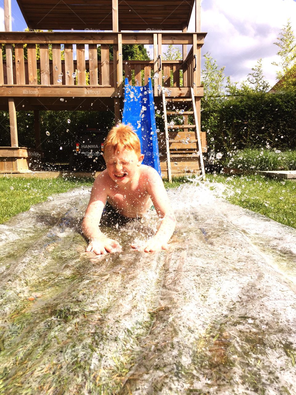 Boy on a waterslide 