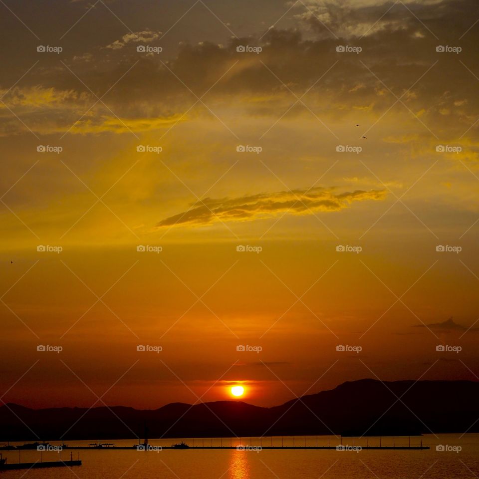 Deep sunset over Corfu Town Old Harbour, Greece