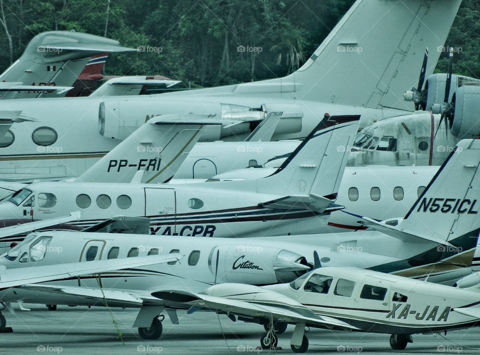 Busy Airport. Many Airplanes Packed Onto Runway Tarmac
