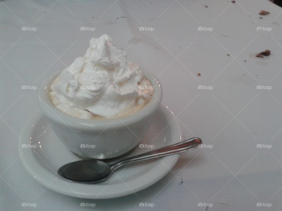 A coffee cup with whipped cream