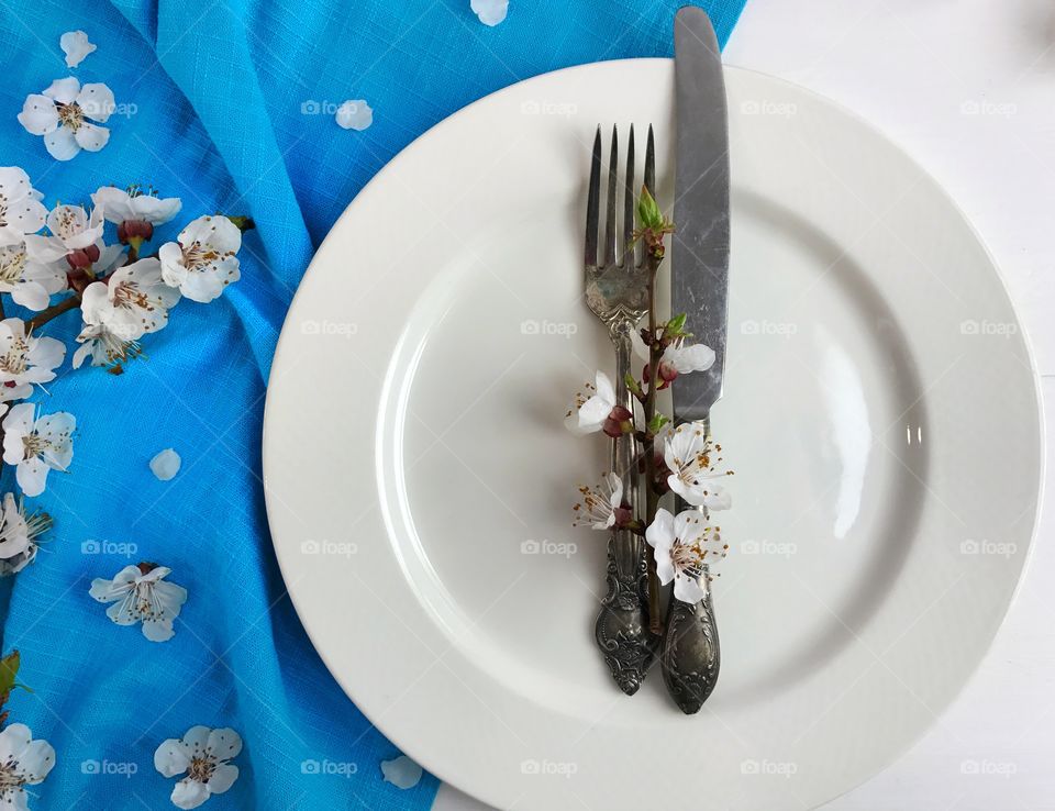 White plate with knife and fork 