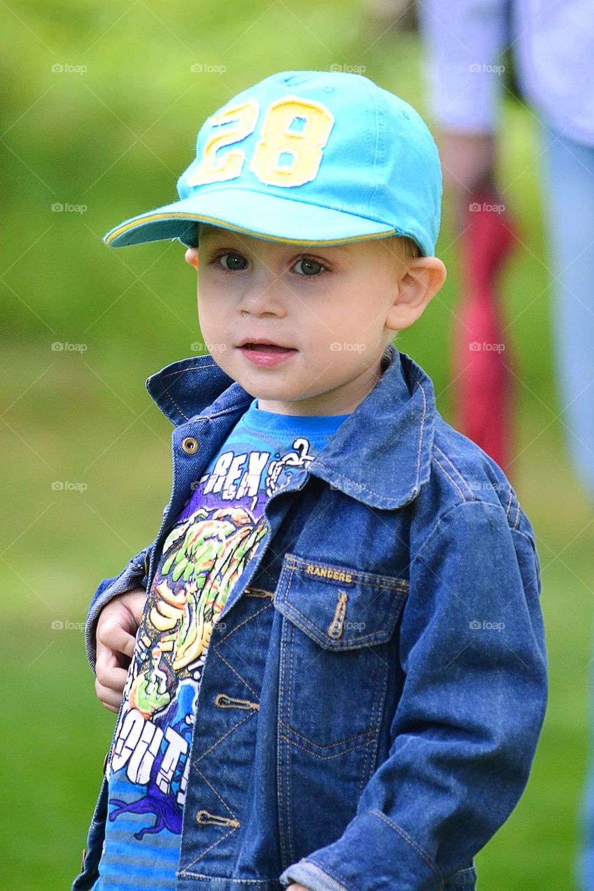Cute young boy wearing cap