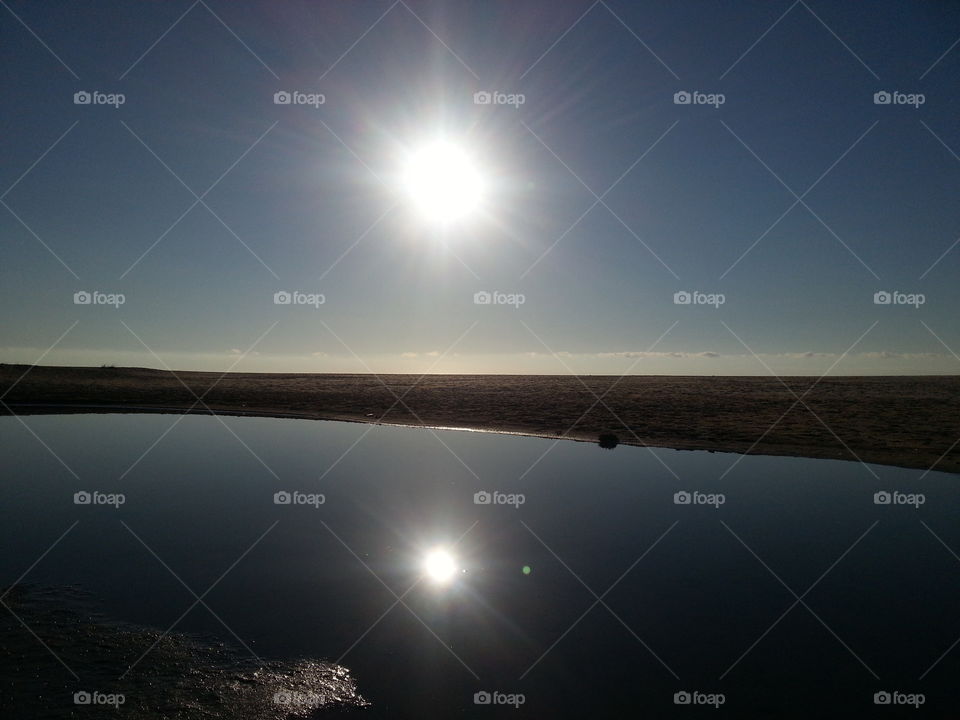 sun reelection in the water. sardinia