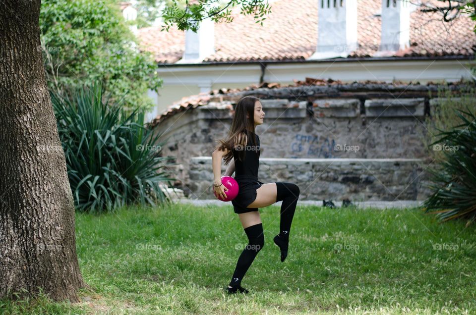 Beautiful Young Gimnast Dancing in Nature