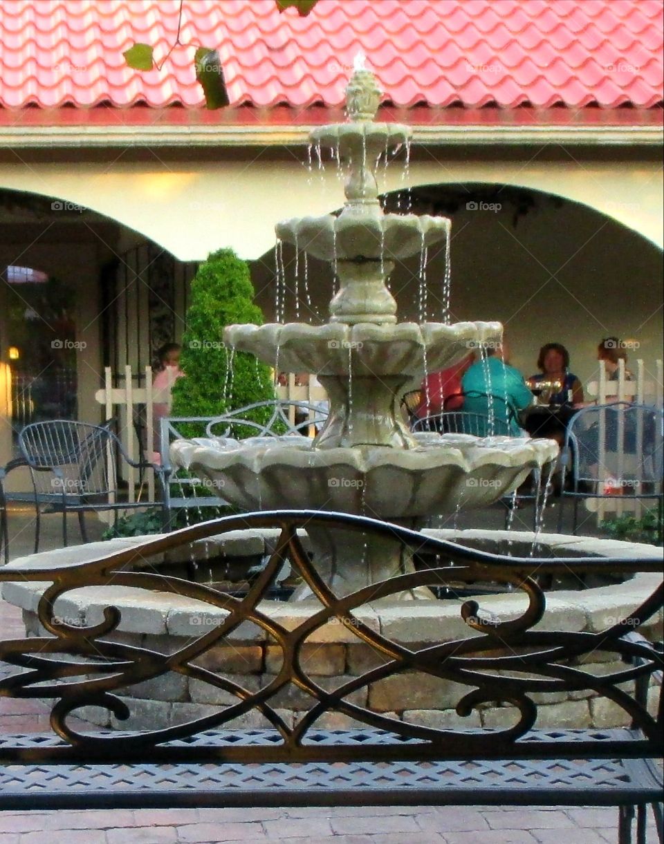 fountain with a bench at a winery