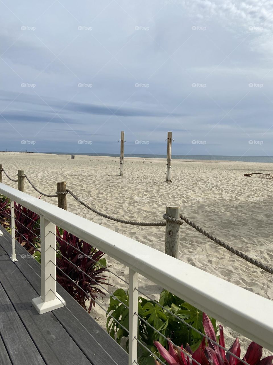A view of Point Pleasant Beach from the boardwalk adjacent to Jenkinson’s, a popular restaurant, bar and nightclub. This is across the fence looking out over a now-empty September beach. No line for the showers today! 