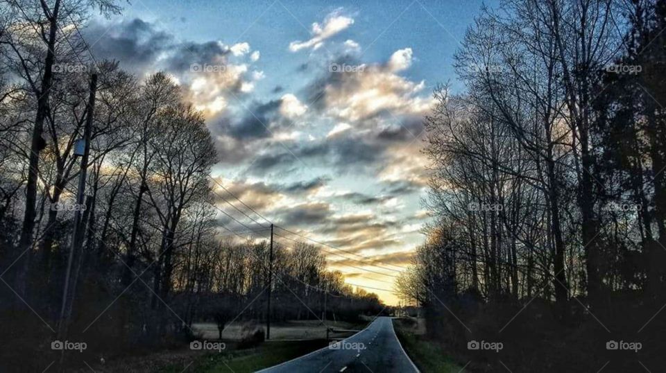 A winter drive in the country in the sunset