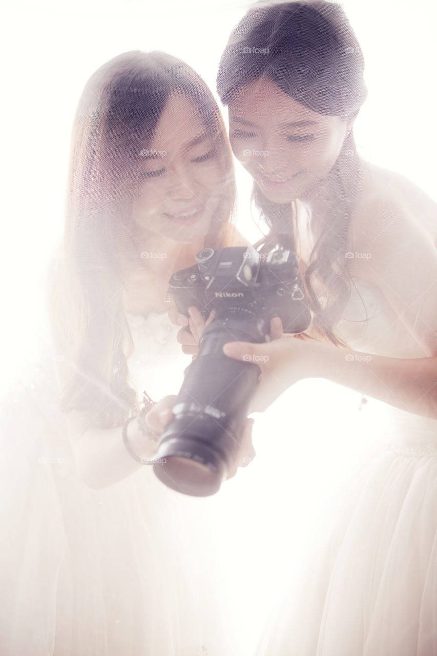 sisters with camera