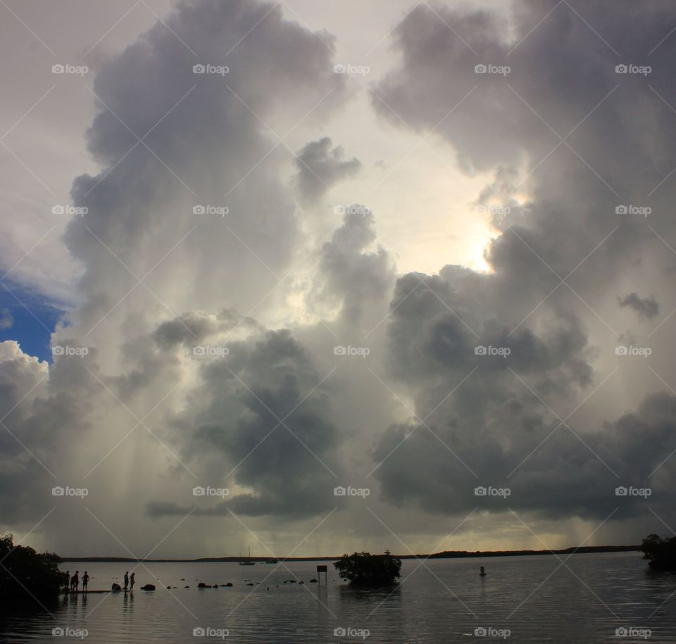 A mix of storm clouds and sun reflect off the coast of Florida 