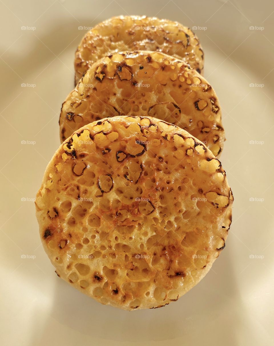 Buttered Crumpets.  A delicious feast that can be enjoyed anytime with a variation of toppings. 