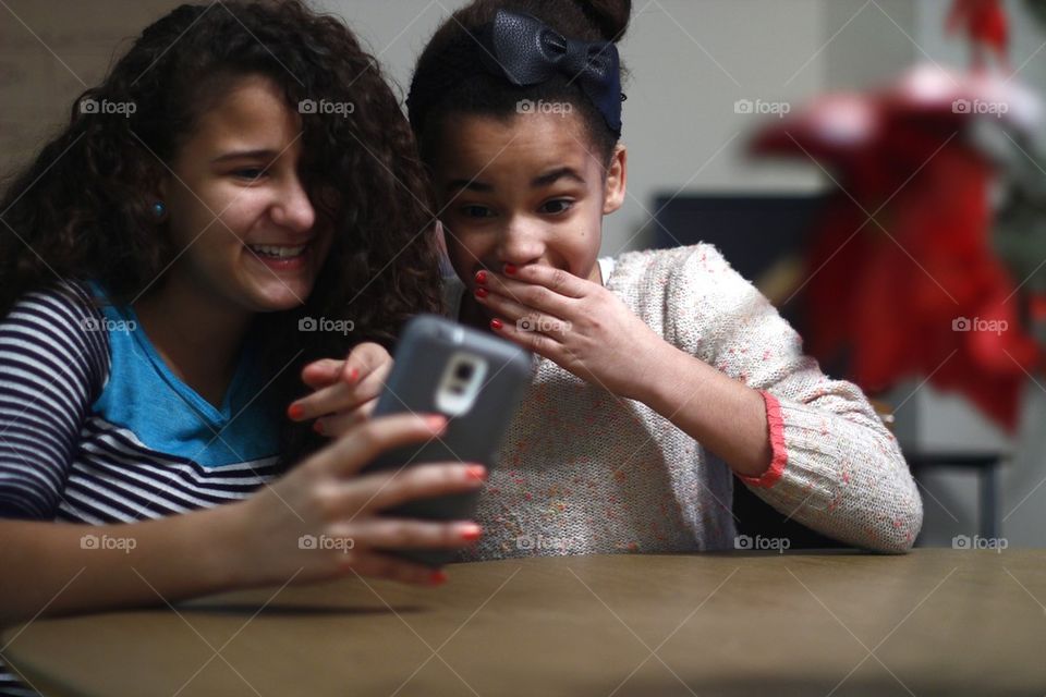 TWO HAPPY SISTERS ON PHONE