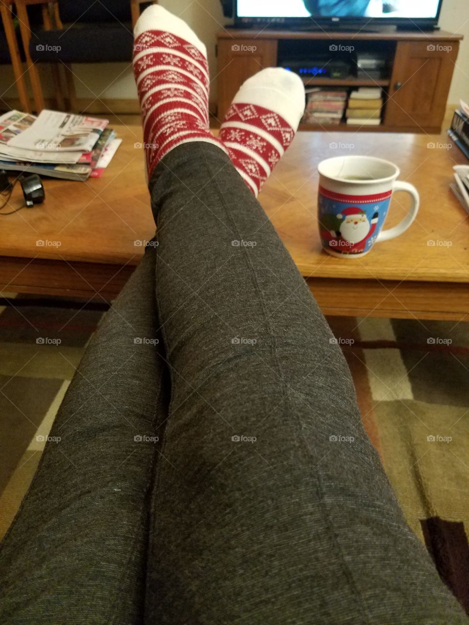 resting on the couch with a cup of tea after a long day of work