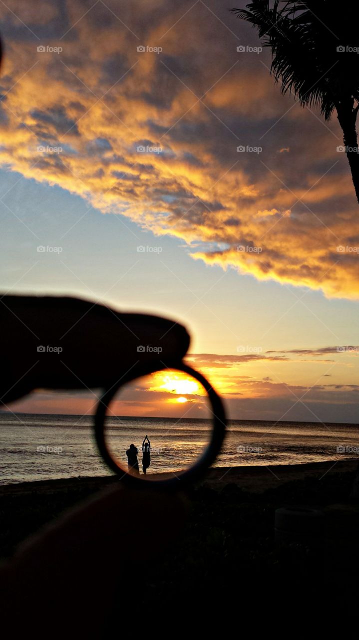 Silhouette of people at beach during sunset