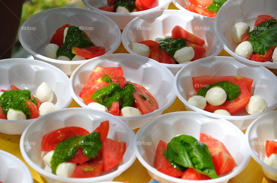 summer salad with tomato, pesto and mozzarella cheese